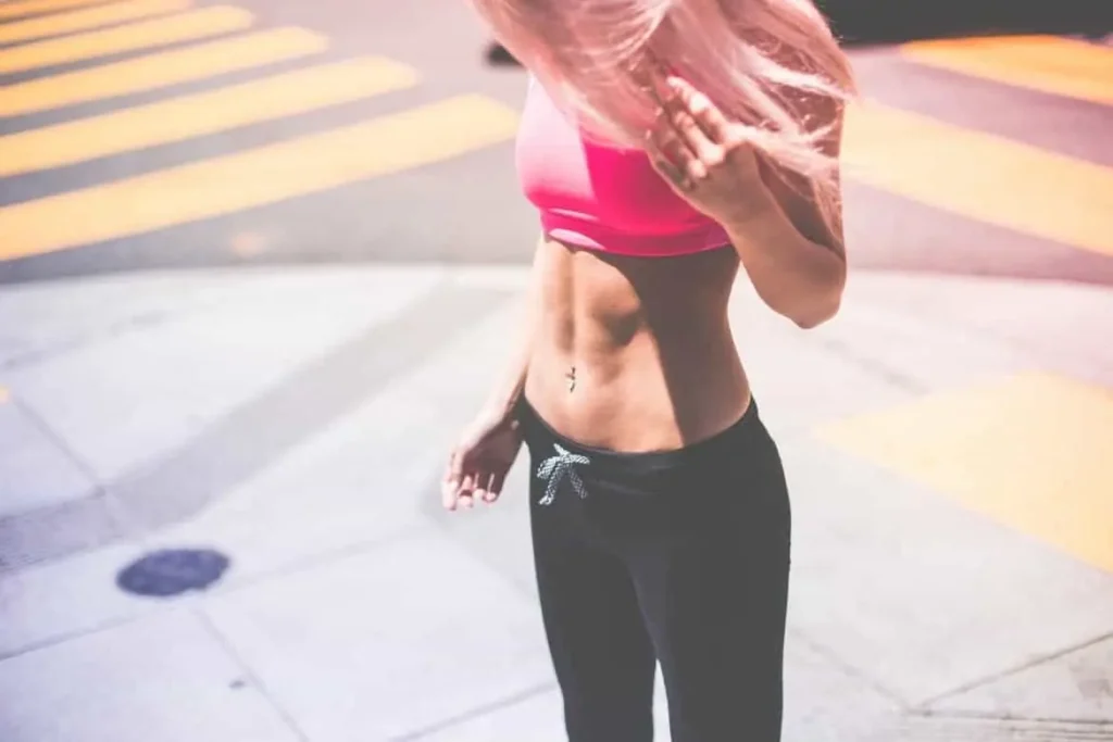 Woman with toned stomach after LA-EMS Body Sculpting Treatment Midhurst